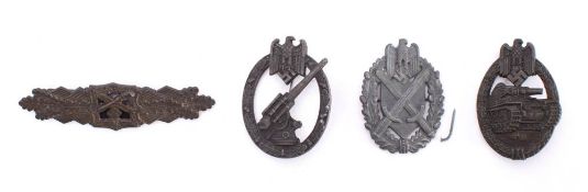 Four Third Reich period style badges: includes Army Flak Badge, Marksman Award Shield,