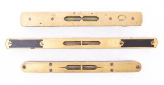 An 8 inch mahogany and brass level by E Preston.