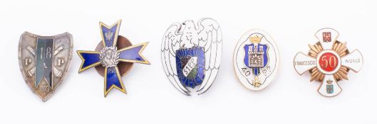 A collection of Polish metal and enamel Regimental association badges: includes,