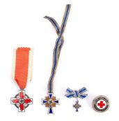 A Second World War German Mother's Cross with miniature: together with a German Red Cross Badge and