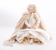 A late 19th /early 20th century bisque shoulder head doll: unsigned, applied blonde wig,