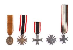 A Third Reich West Wall Medal: together with a War Merit Cross, First Class, two War Merit Crosses,