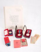 Two Imperial Service medals in cases of issue: one to Ruben J Hill, with certificate,