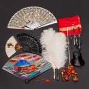 A 19th century mother of pearl fan: (damaged) together with two single white ostrich feather fans,