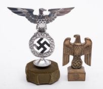 A German bronze desk paperweight: in the form of an eagle over a swastika and an oak leaf wreath on