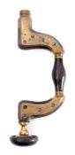 A brass framed brace by A Mackie, Edinburgh: with ivory ring to pad.