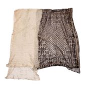 An Assuit black cotton and metal decorated shawl: 70 x 218cm,