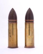 A pair of WWI French Hotchkiss 37mm artillery shells: the bases stamped '37-85 pdps 242 1.