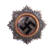 A Third Reich German Gold Cross: * Notes Militaria artefacts are reproduced in significant