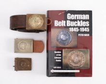 An 1847 pattern German army buckle on a brown leather belt:, the belt stamped 'BAG 10' and '95'.