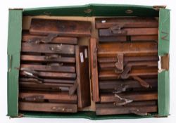 A collection of twenty one various wooden moulding planes: various makers including Buck, Hicks,