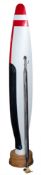 A propeller blade: painted red, white and black, mounted on a wooden socle, 184cm high,