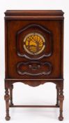 An Ekco Type RG5 Radio Gramophone: of rectangular form with hinged top the front with circular