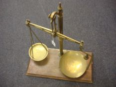 A set of brass and mahogany balance scales by Barnall & Sons,
