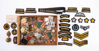 A collection of various militaria: comprising buttons, badges and cloth patches,