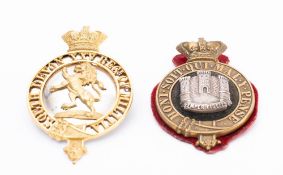 A Devonshire Regiment cap badge: together with a replica South Devon XXV Regt of Militia cap badge.