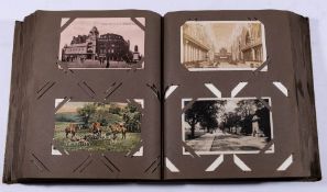An album of assorted Edwardian and later postcards: includes humour, greetings, birthdays,