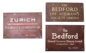 Two brass and enamel building name plates for 'The Bedford' Insurance Company: together with one
