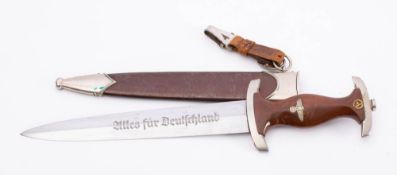 A Third Reich SA dagger by Puma: the straight double edged blade with legend,