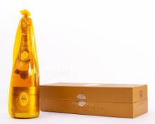 A bottle of 1988 Louis Roederer Cristal Champagne: in original wrapper and box.