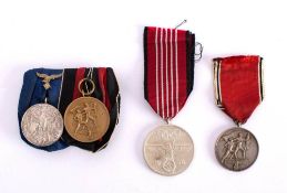 A group of four German medals: Luftwaffe Four Years Long Service Medal,