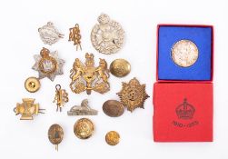 A small collection of various military buttons and badges: including two 'ATS' brass collar