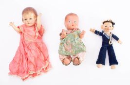An early 20th century felt sailor doll 'HMS Vivid': together with two composition dolls (3)