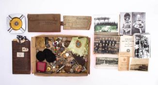 A collection of various militaria: mostly various buttons and badges,