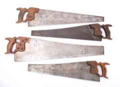 A group of seven Disston rip saws.