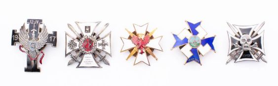 A collection of Polish metal and enamel Regimental association badges: includes 28th Kaniowski