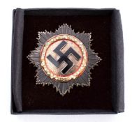 A replica Third Reich German Cross in gold: inset with brilliants.