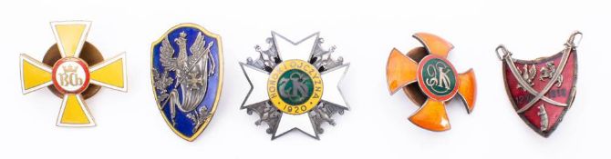 A collection of Polish metal and enamel Regimental association badges: includes White Cross
