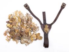 A collection of various military cap badges,