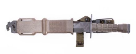 A US Army M9 pattern Lan-Cay military bayonet in scabbard.