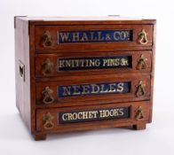 An early 20th century shop counter display cabinet for 'W Hall & Co': of four short drawers with