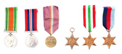 A group of five WWII general service medals and a 5th Army Bay Of Naples Commemorative medal: