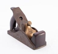 A Norris No.12 smoother, stamped as per title: mahogany infill and closed handle, Norris iron.