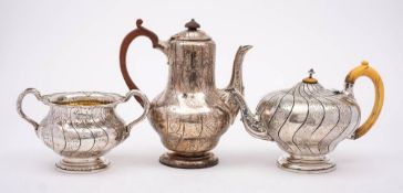 A Victorian silver part tea and coffee set, maker Robert Garrard II, London,