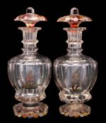 A pair of Bohemian polychrome decorated glass decanters and stoppers: of octagonal form with flared
