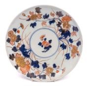 A Japanese Imari dish: relief moulded and painted with chrysanthemum and peony sprays, Edo period,