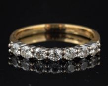 A diamond seven stone ring,: set with brilliant cut diamonds, approximately 0.
