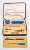 A George V silver and blue enamel manicure set for Asprey, London, 1928: includes nail buffer,