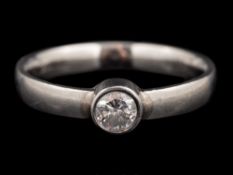 A platinum diamond ring,: the brilliant cut diamond estimated to weigh 0.