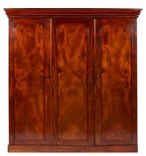 An early Victorian mahogany three door wardrobe press, circa 1840,