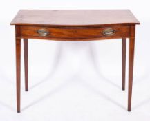 A George III mahogany serpentine front dressing table, circa 1775,