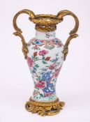 A Chinese ormolu-mounted famille rose baluster vase: brightly enamelled with tree peony,
