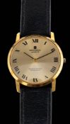 Universal, Geneve, Golden Shadow, a gold wristwatch,