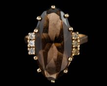 A smoky quartz ring,: set with a marquise cut smoky quartz, ring size N.