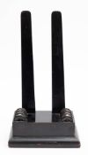 A Regency period ebonised wood charger stand: the pair of supporting struts inserted in a