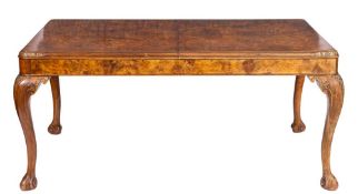 A burr walnut extending dining table, circa 1900,: each half of the top with two quarter veneers,